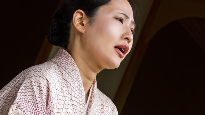 なっとくした表情の女将