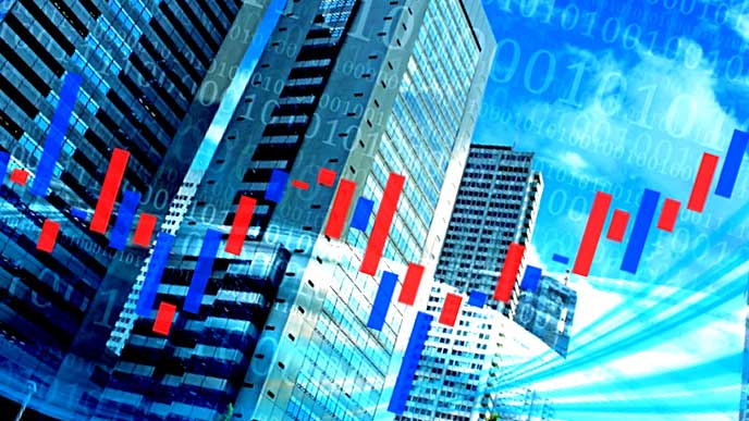 株のグラフと企業ビル
