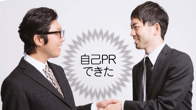 握手をする会社員