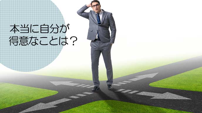 十字路で自分の進路に迷うビジネスマン
