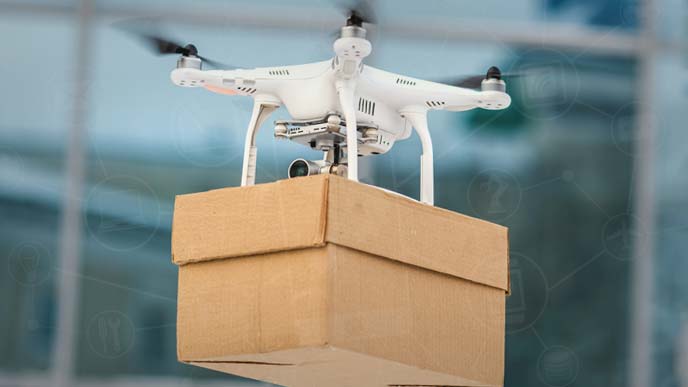 ドローンが荷物を運搬しているところ