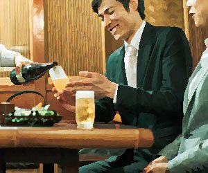 居酒屋で食事をする社員